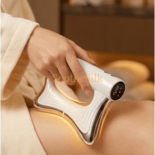 Massager with its warm glowing edge resting on the leg