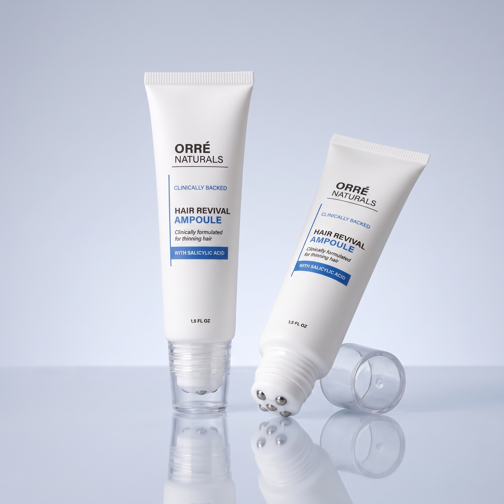 Two white scalp ampoule tubes with metal rollerball tips