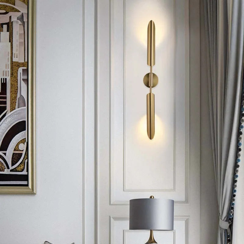 Phira gyllene vägglampa med dubbla huvuden i skidtuppsdesign