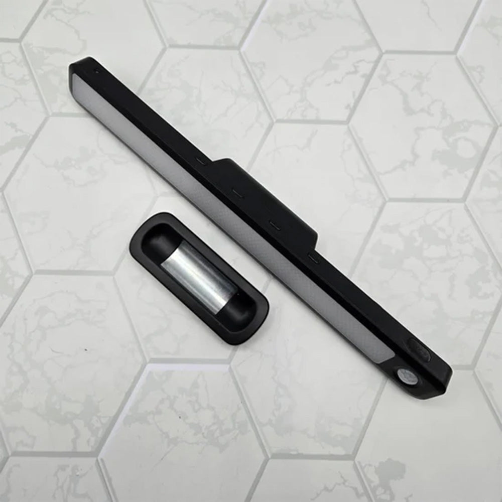 Black light bar next to its magnetic mounting plate