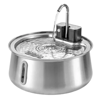 Stainless steel fountain with water flowing from the faucet