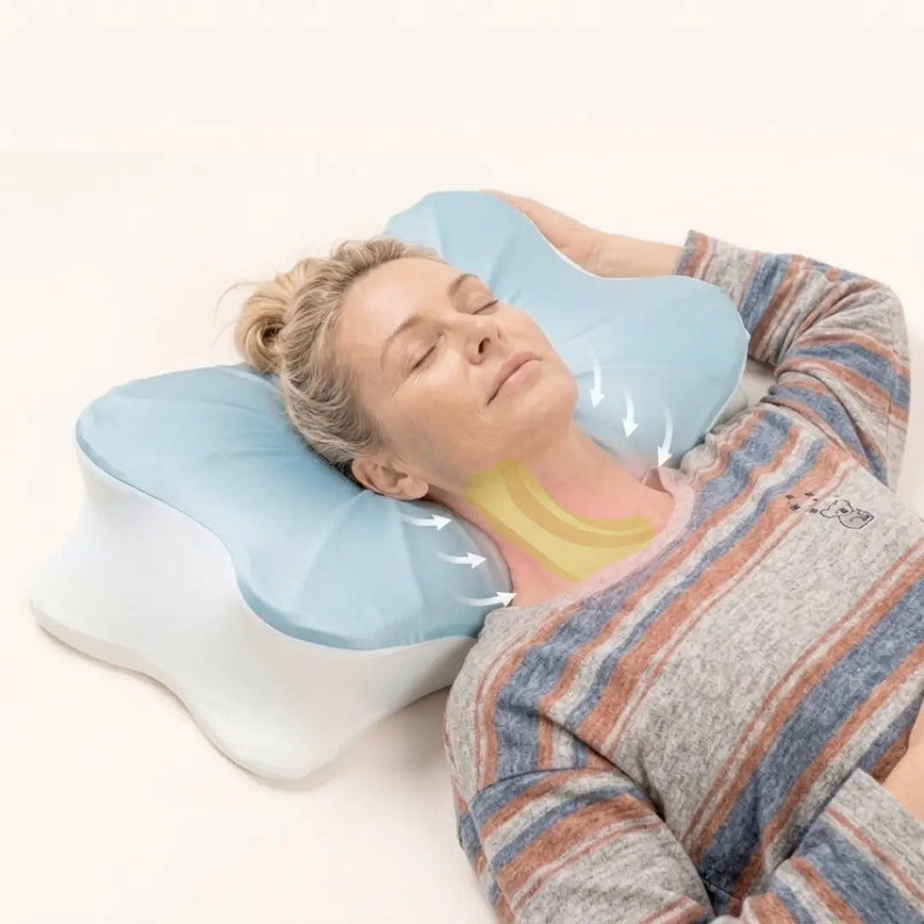 Woman lying on her back with her neck resting on the contour of the pillow