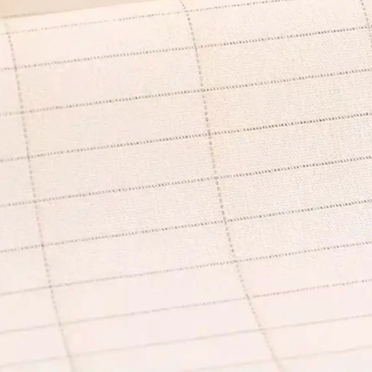 Close-up of organic cotton grounding sheet with silver thread grid