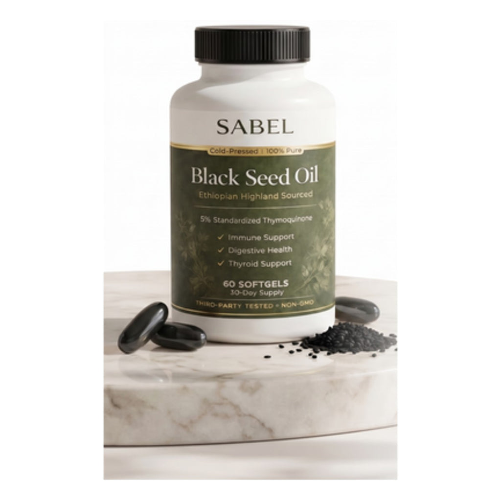 Black seed oil softgels bottle on marble