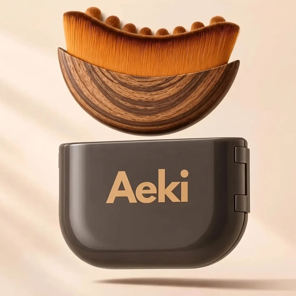 Soft-bristle facial massage brush with wooden-look back above its storage case