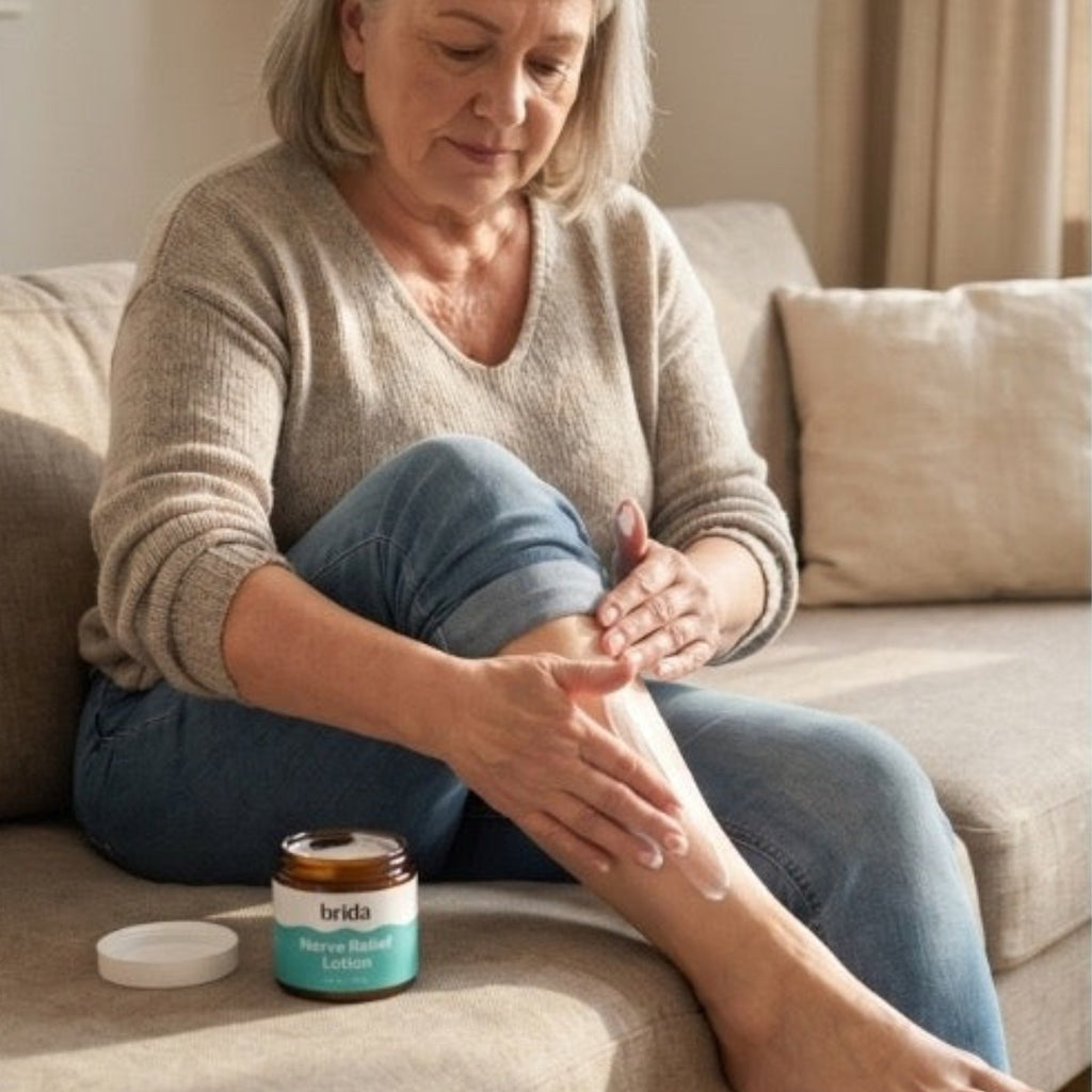 Woman massaging the soothing lotion into her leg at home