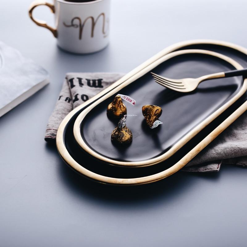 أطباق خزفية برسومات فرشاة باللونين الأسود والذهبي | Orntli