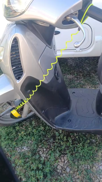 Scooter with the reminder cable looped from the lock to the handlebar