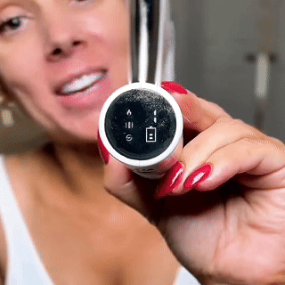 Close-up of the massager display showing the settings