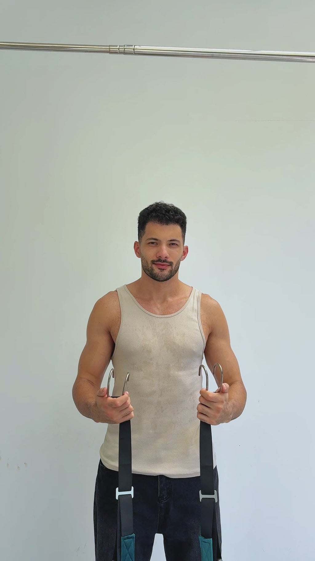 Man standing and holding the neck stretcher straps