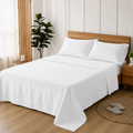 White VivoSleep pure linen bed sheets are made up on a double bed.