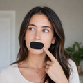 A sleeper wears VivoSleep mouth tape across gently closed lips.