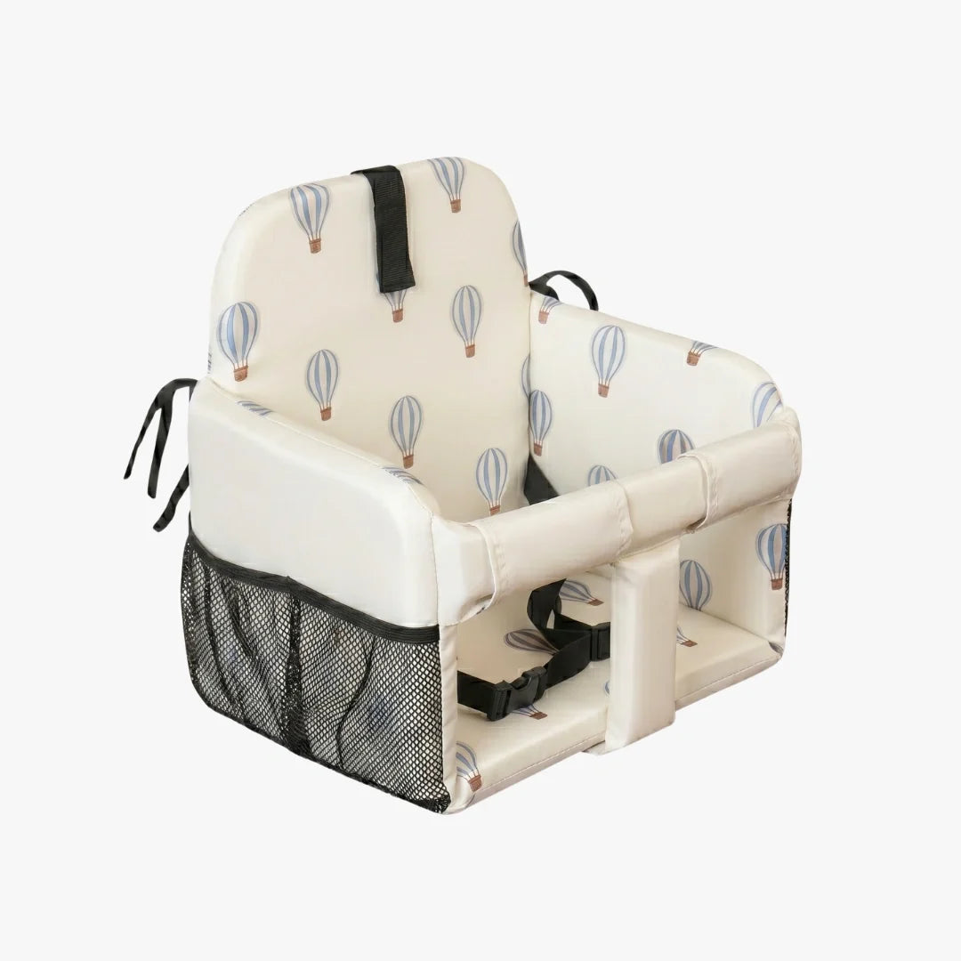 Baby high chair with hot air balloon pattern on a white background