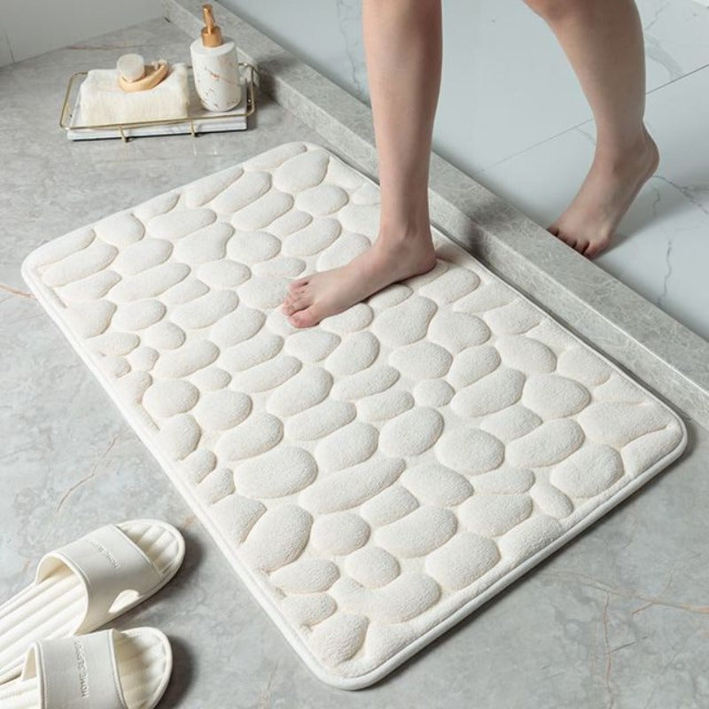 Alfombrilla de baño Cauzac™ con diseño de guijarros y espuma viscoelástica